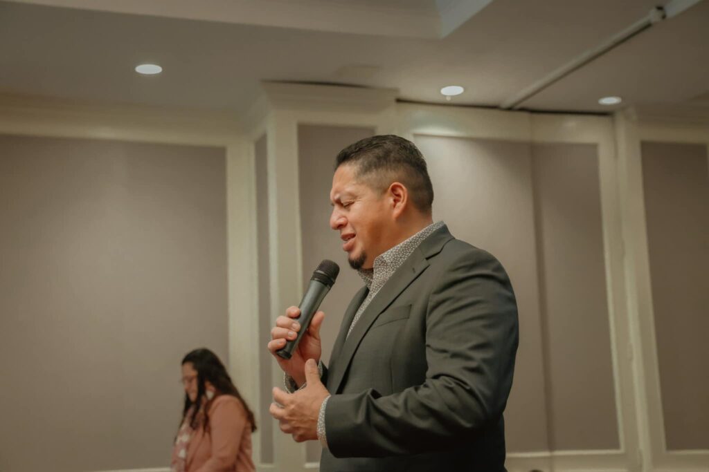 Apostle Carlos Contreras leading prayer