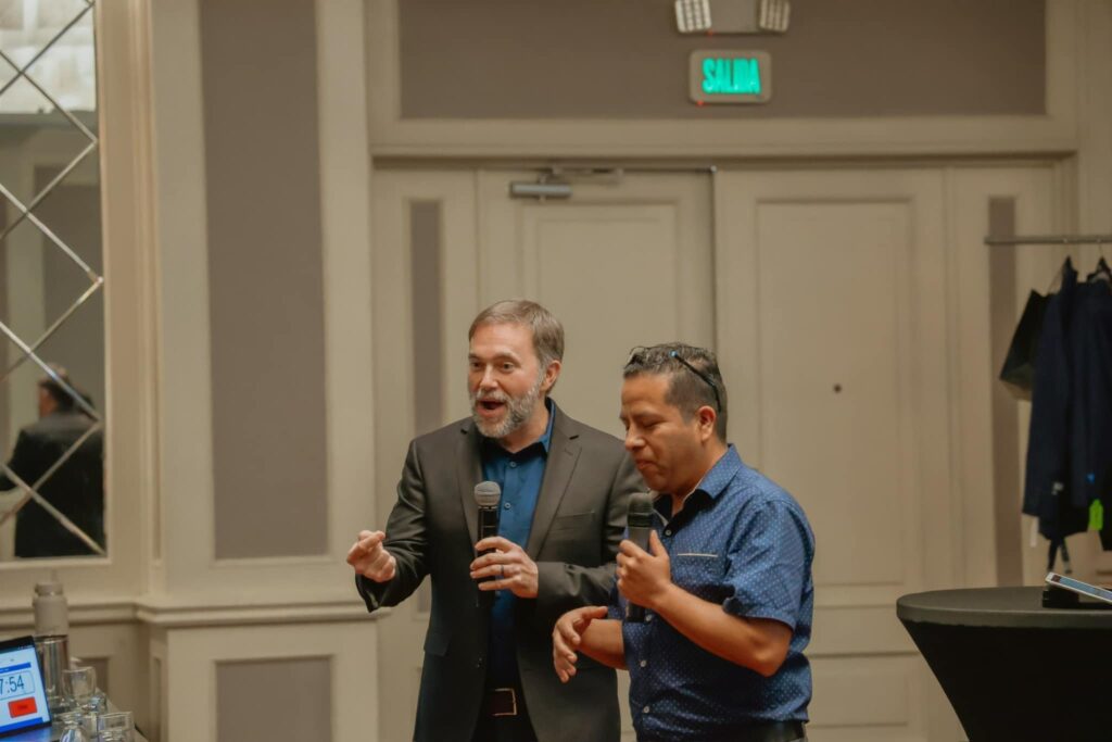 Pastor Kirk preaching and Pastor Ricardo translating
